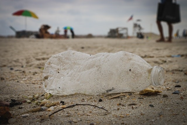 A plastic water bottle on the beach