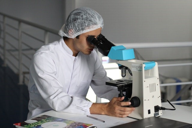 An individual conducting environmental research in a lab